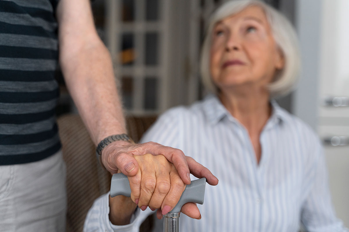 elderly woman looking her caregiver ageing in place
